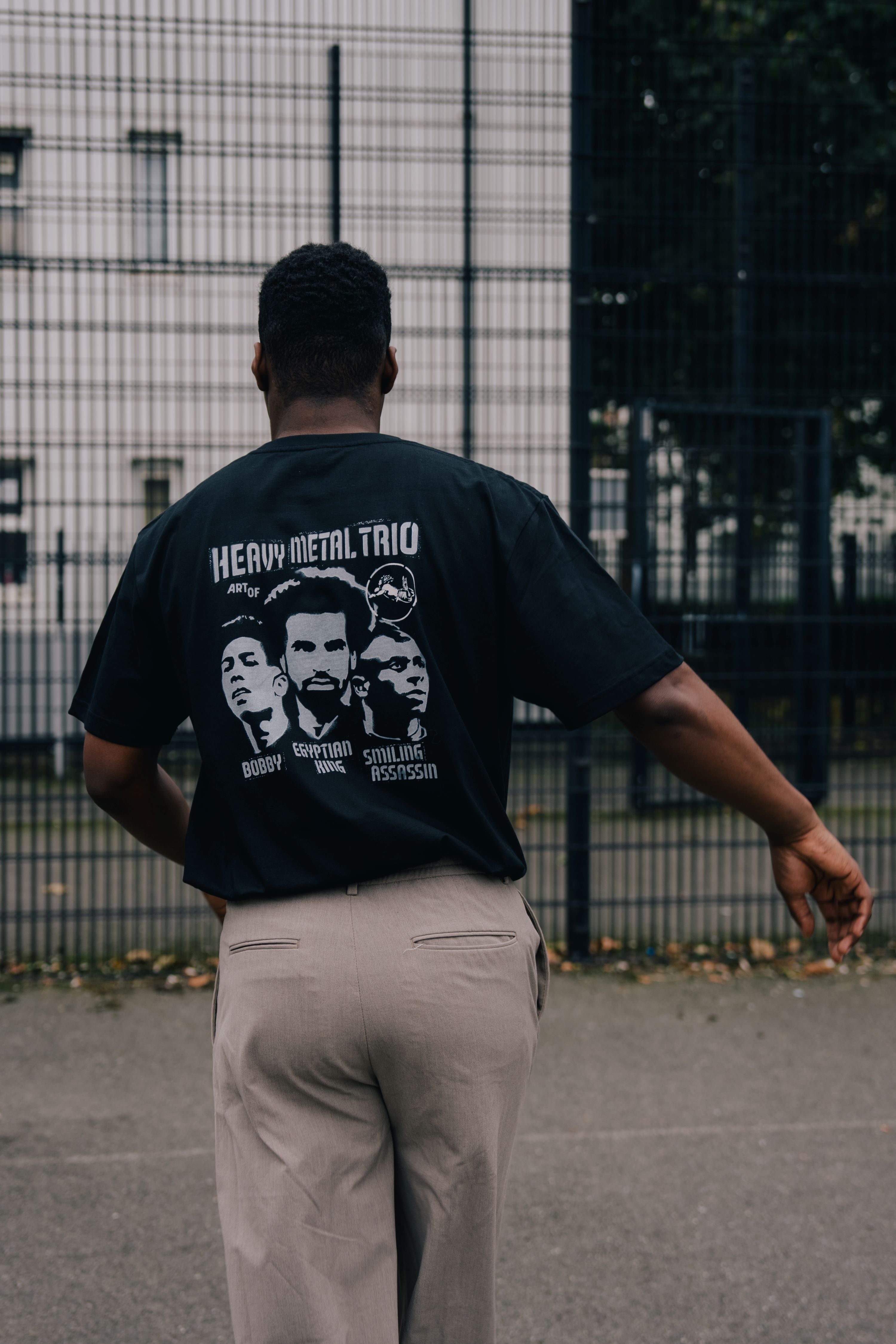 ART OF Secret Tournament Heavy Metal Trio Tee | Black Football T-shirt